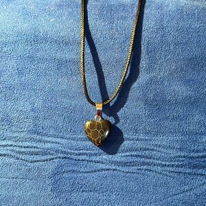 Black with white lines hart pendant‎ necklace.